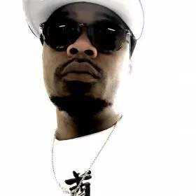 DJ SlimJones in a white cap and sunglasses